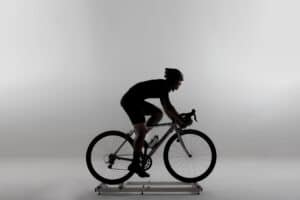 Image of man riding on best bike rollers