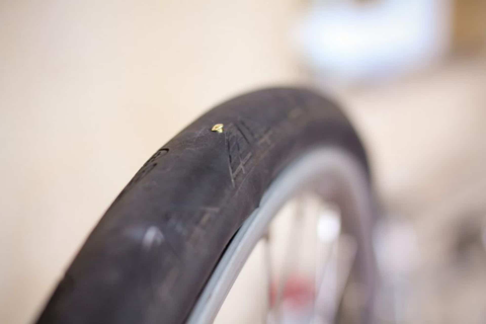 Image showin nail in bike tire first stage of how do you fix a bike tube