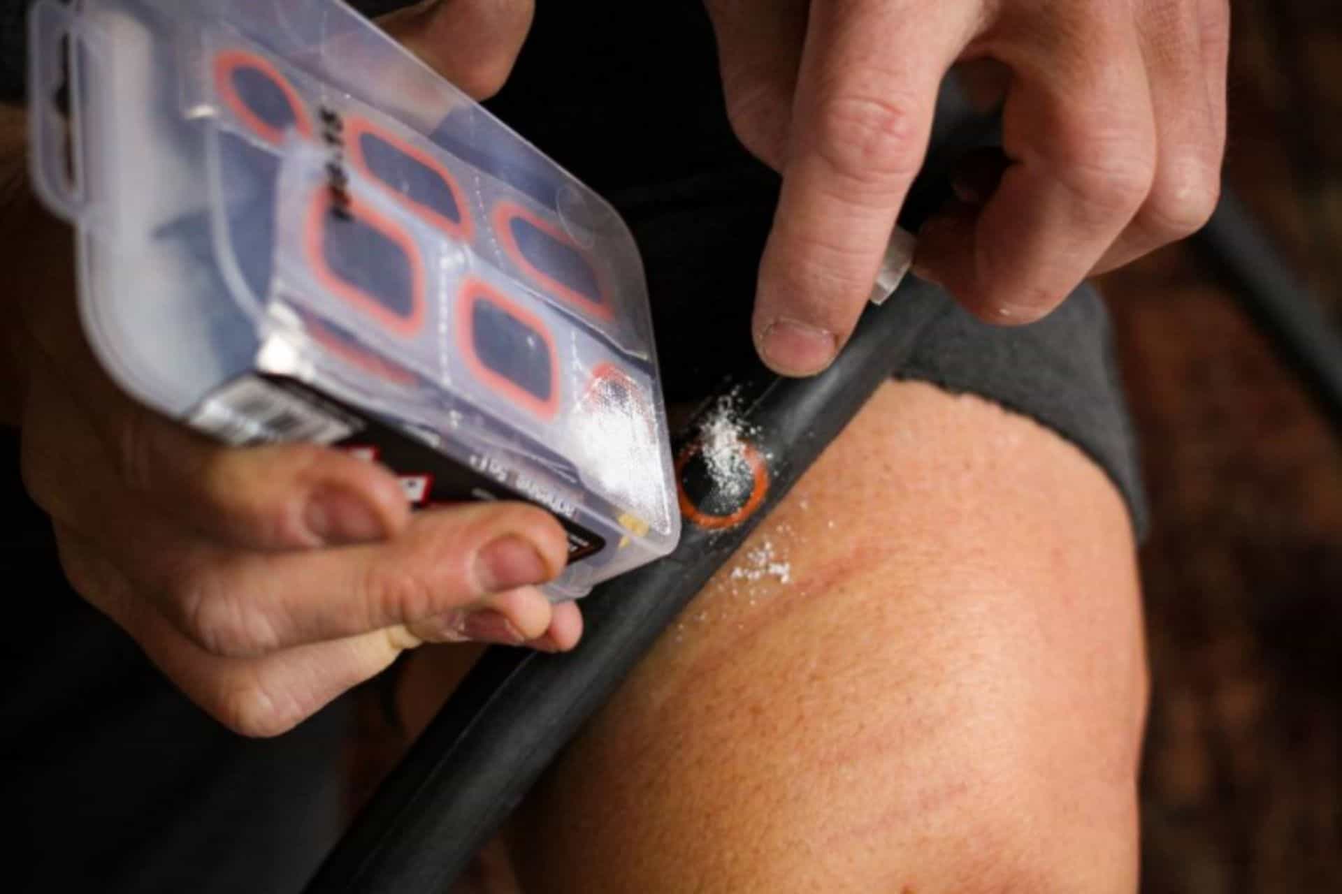 image showing how to fix a bike tube applying french chalk to repaired area